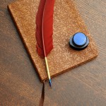 Journal with red feather